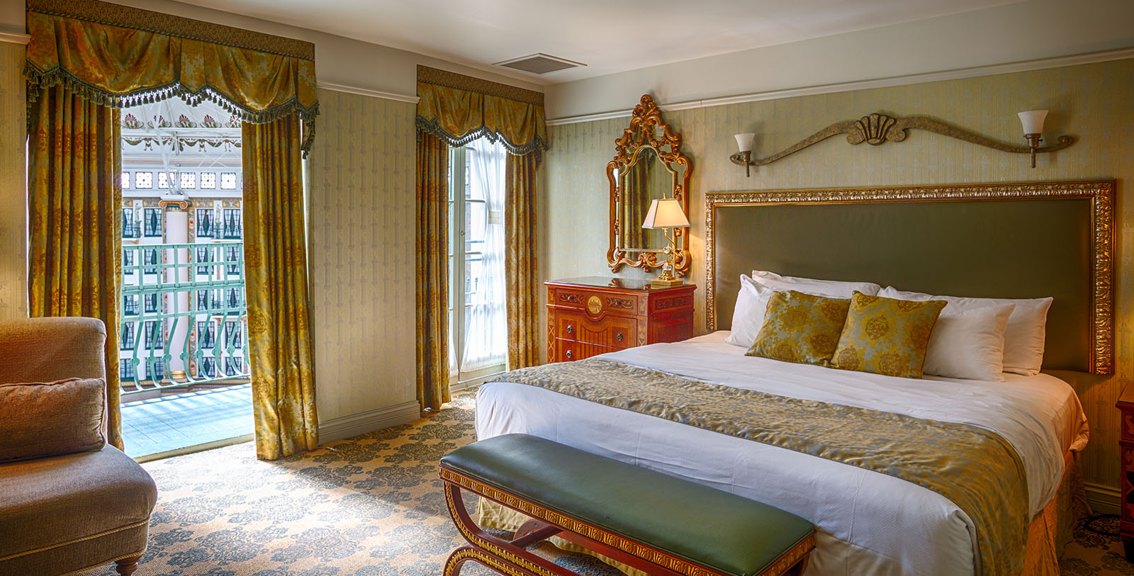 a bedroom with a bed and a mirror