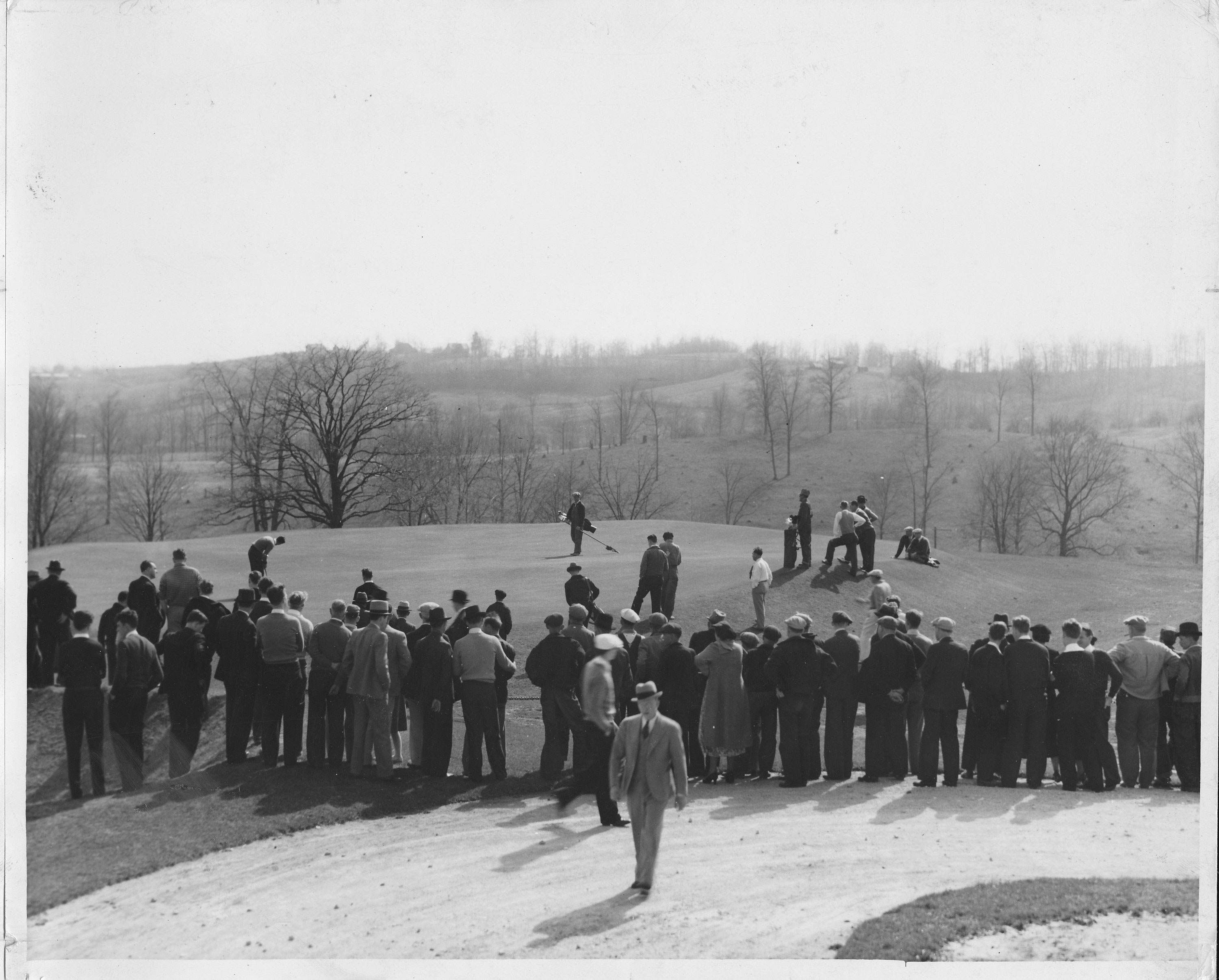 a group of people standing on a hill