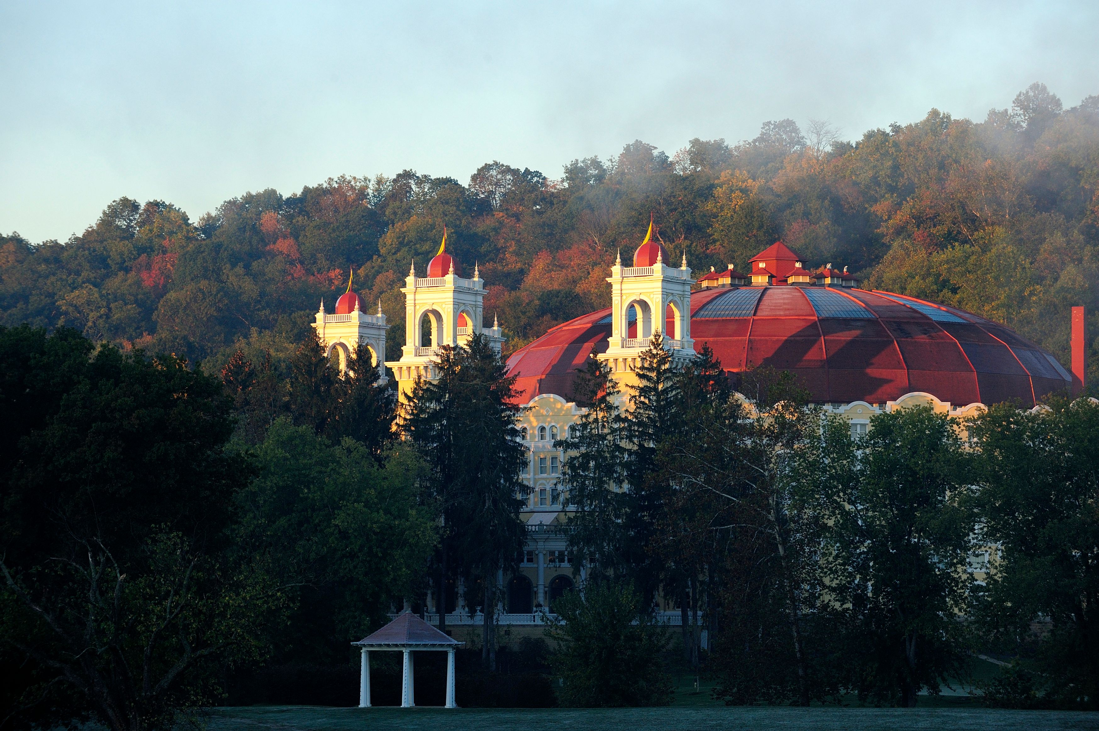 a building with a red roof surrounded by trees