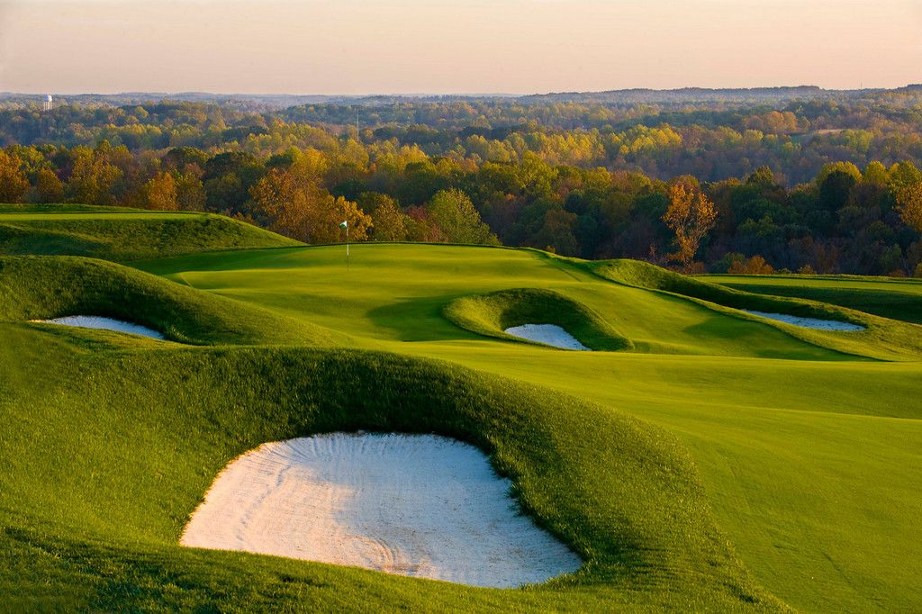 a golf course with sand bunkers