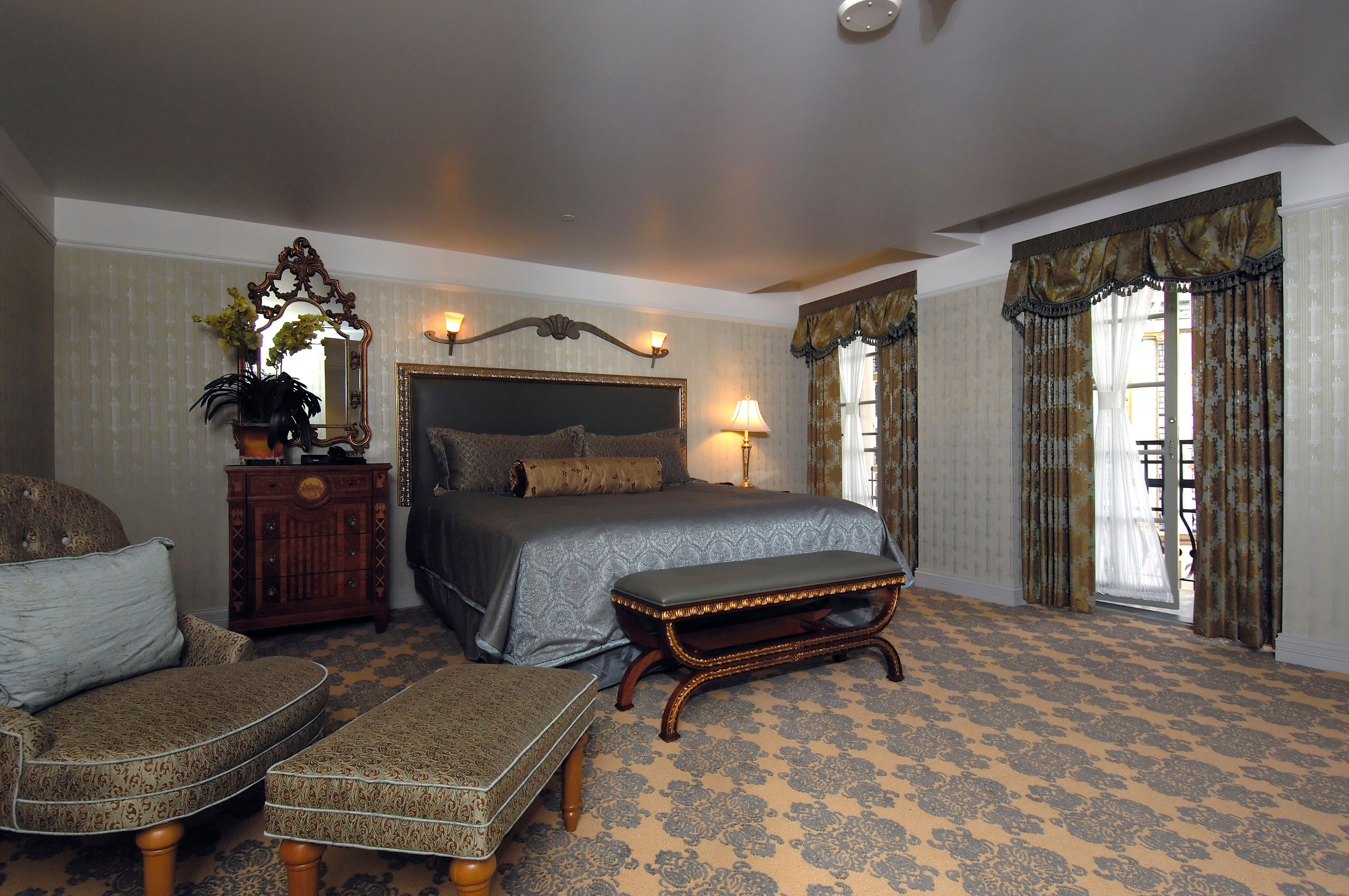 a bedroom with a bed and a bench