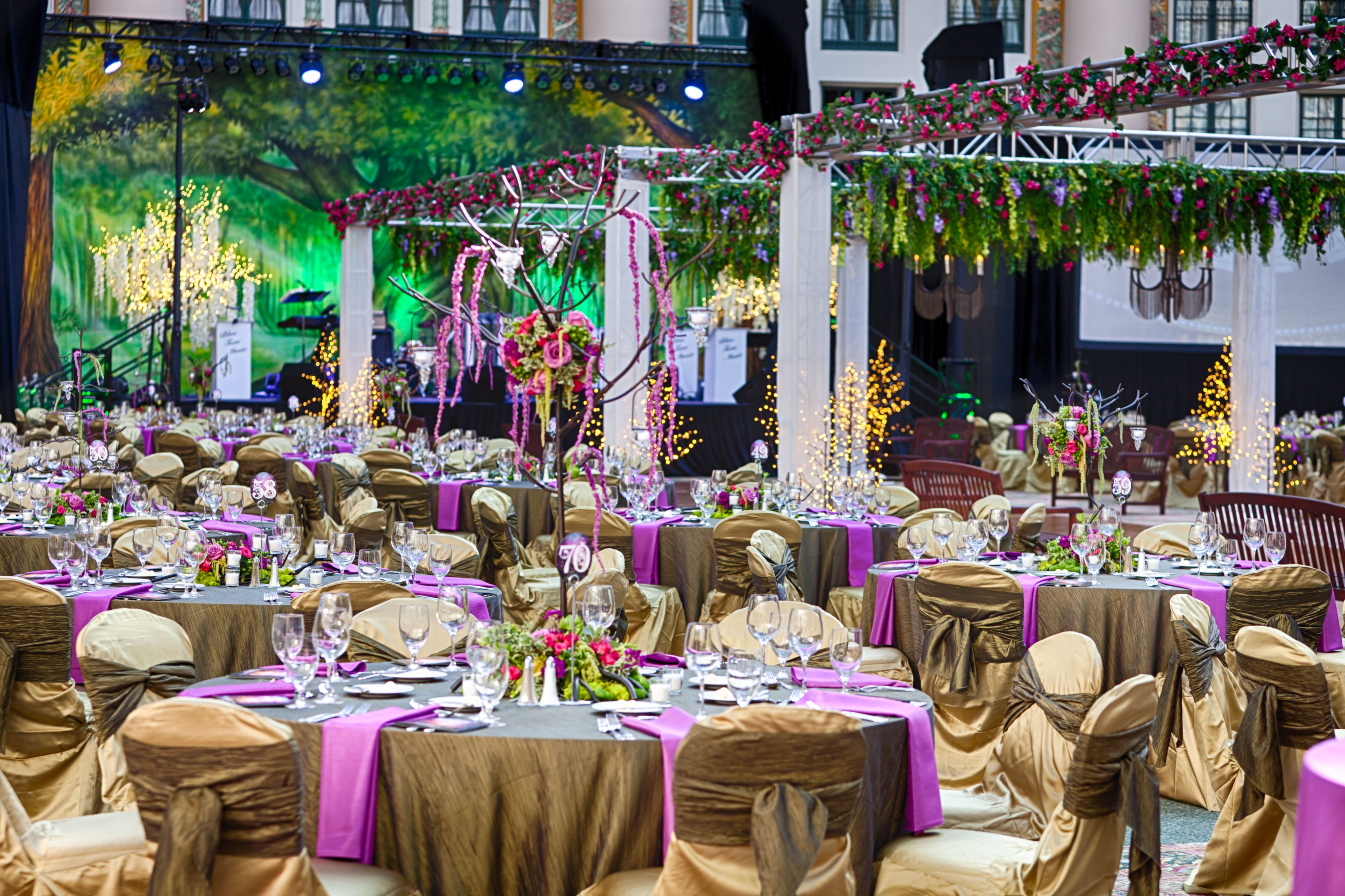 a set tables with chairs and tables covered in cloths