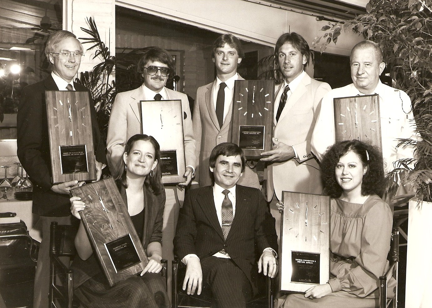 a group of people holding plaques