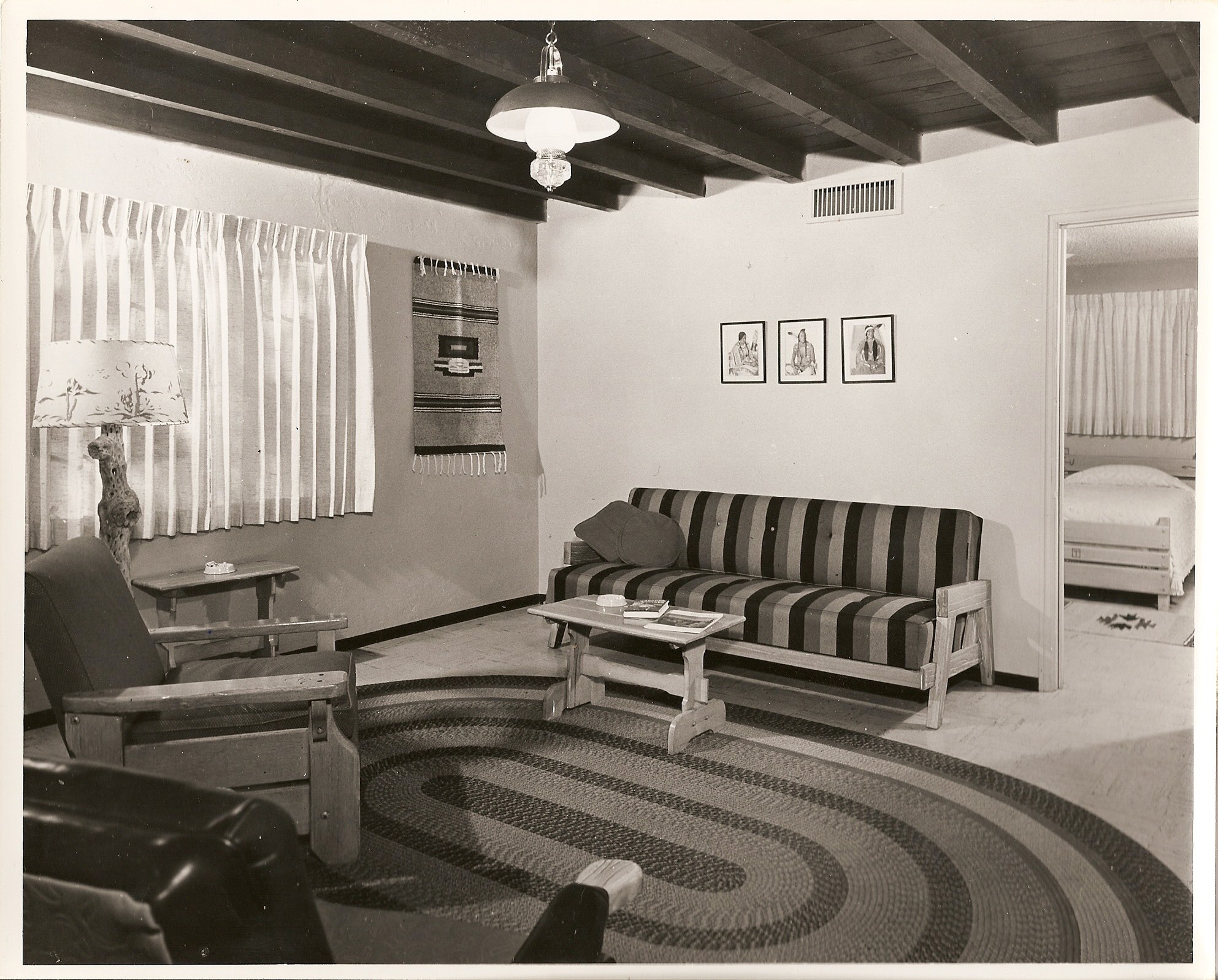 a living room with a couch and a rug