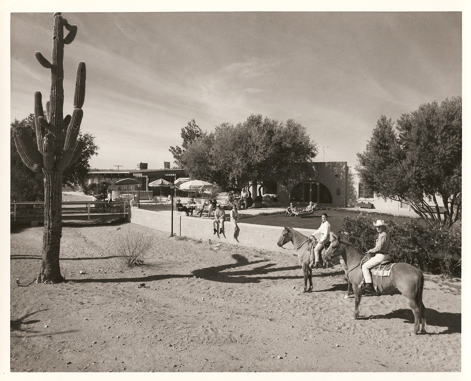 a group of people riding horses