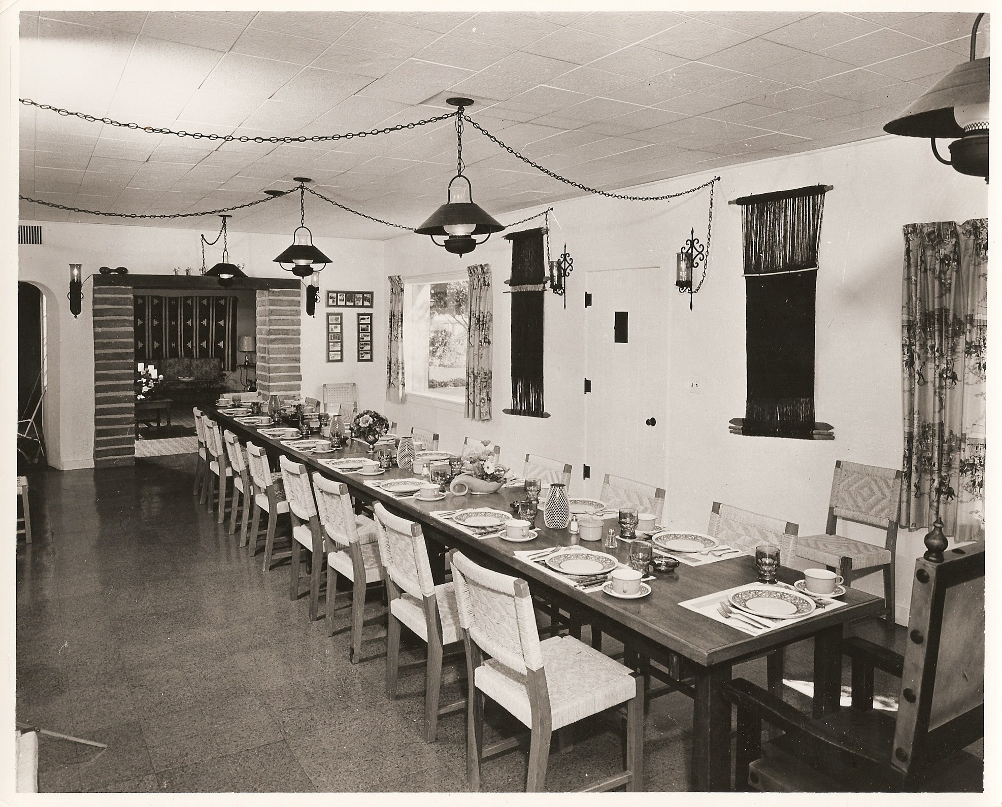 long table with plates and plates on it