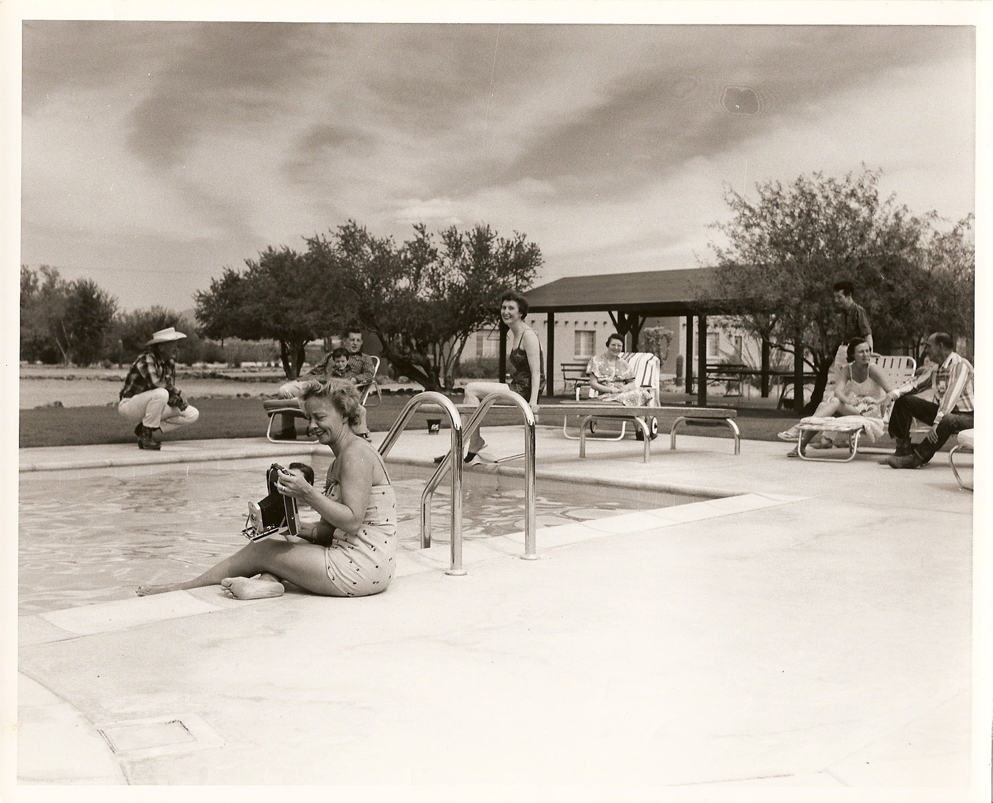 a group of people sitting in a pool