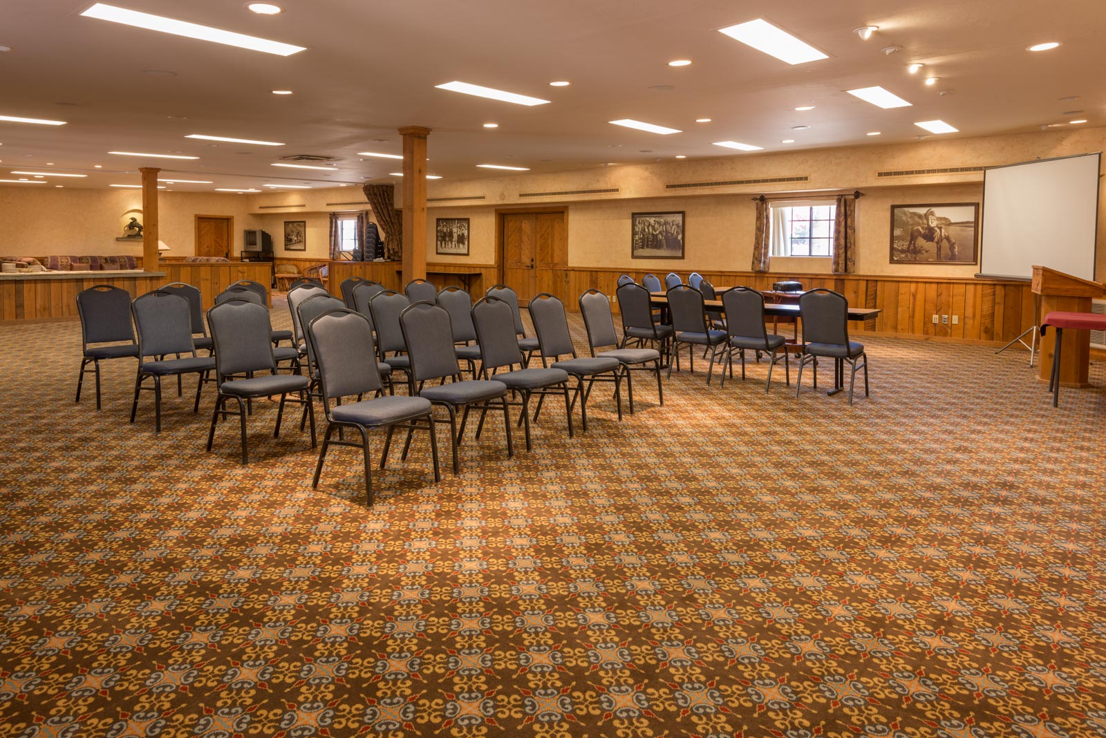 a room with many chairs and tables