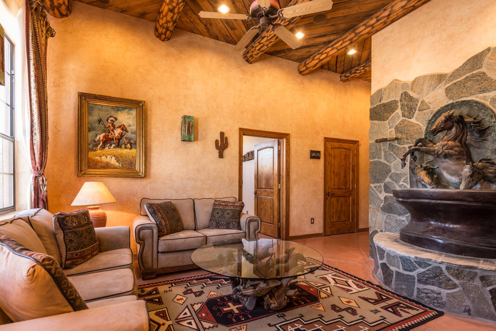 a living room with a fireplace and a couch
