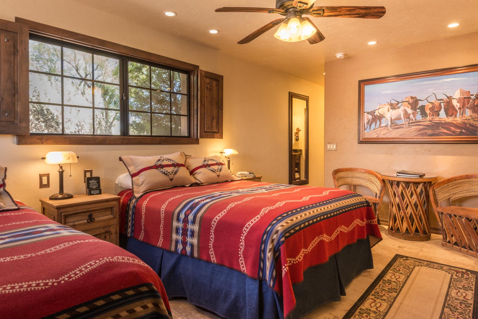 a bedroom with a bed and a fan