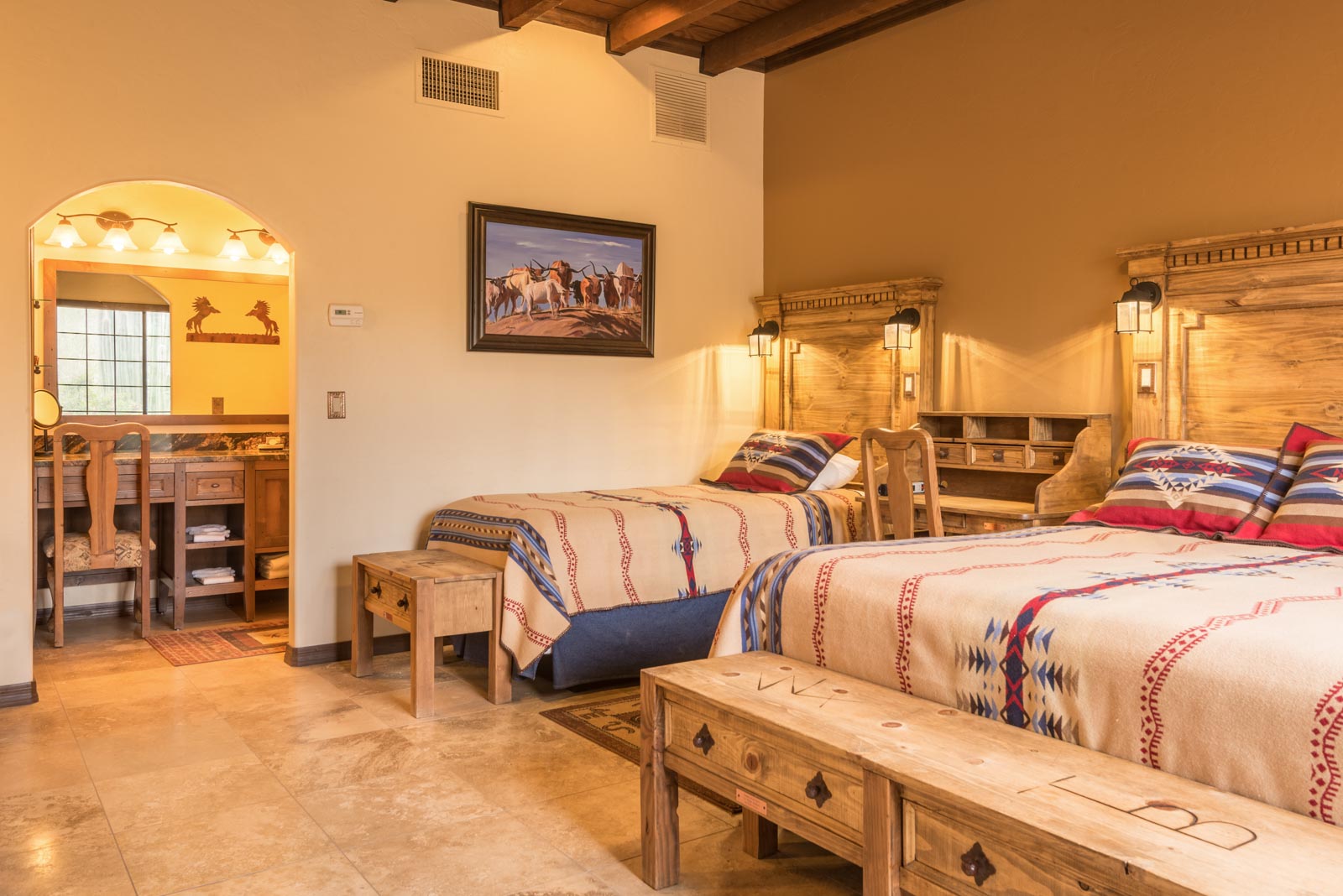 a room with two beds and a bed and a table