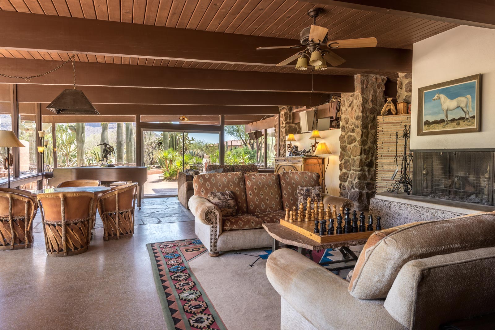 a room with couches and chess board