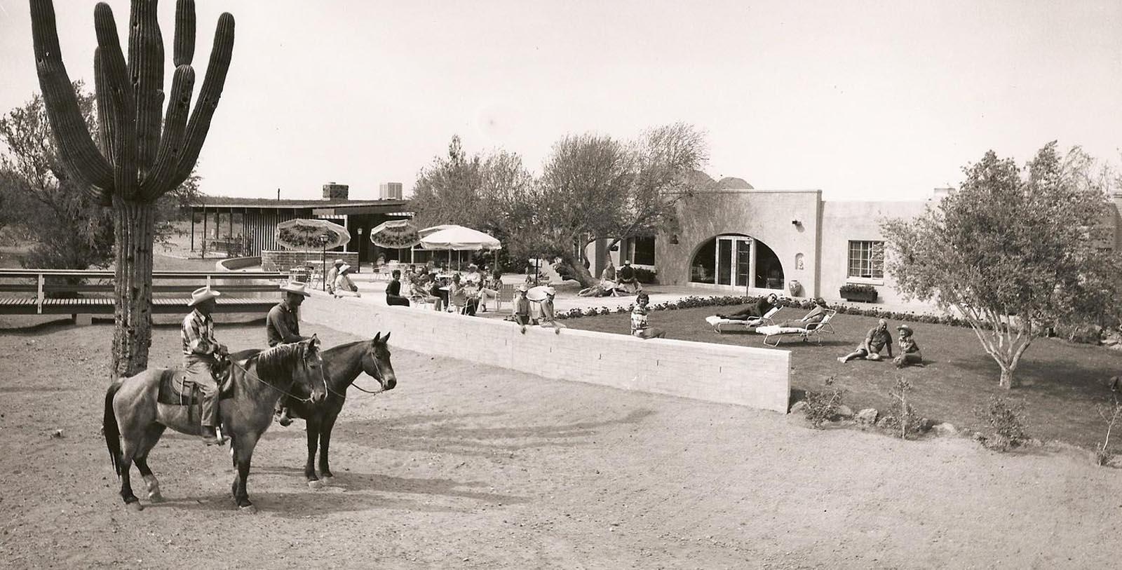 a man on a horse in a courtyard