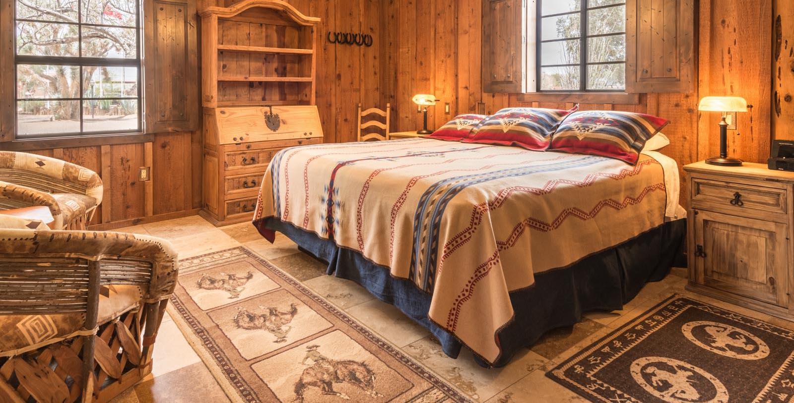 a bedroom with a bed and a rug