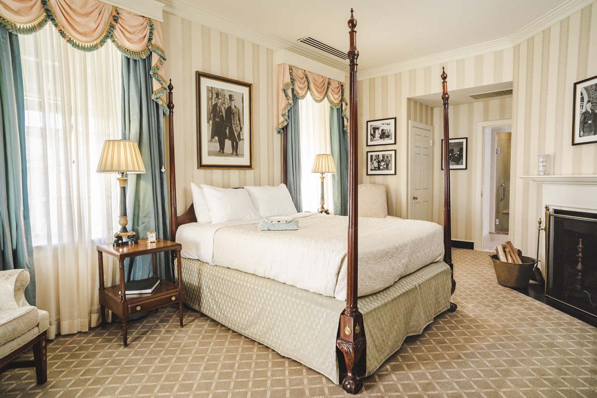 a bedroom with a four poster bed