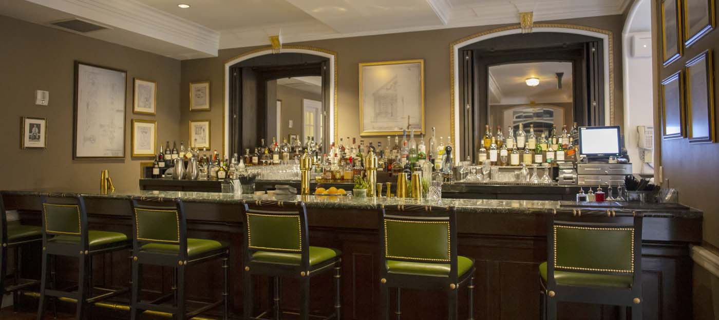 a bar with many bottles of alcohol