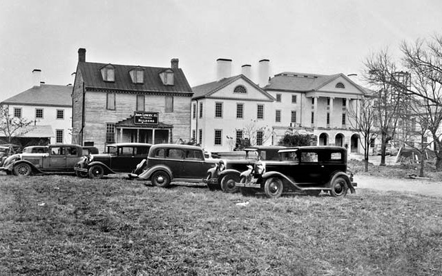 a group of cars parked in a field