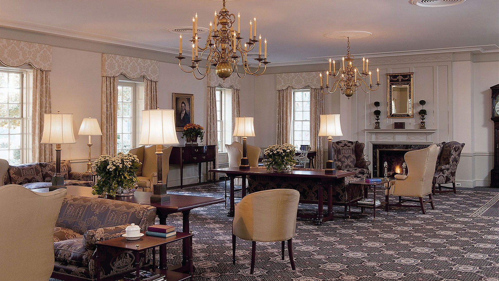 a room with chandeliers and tables