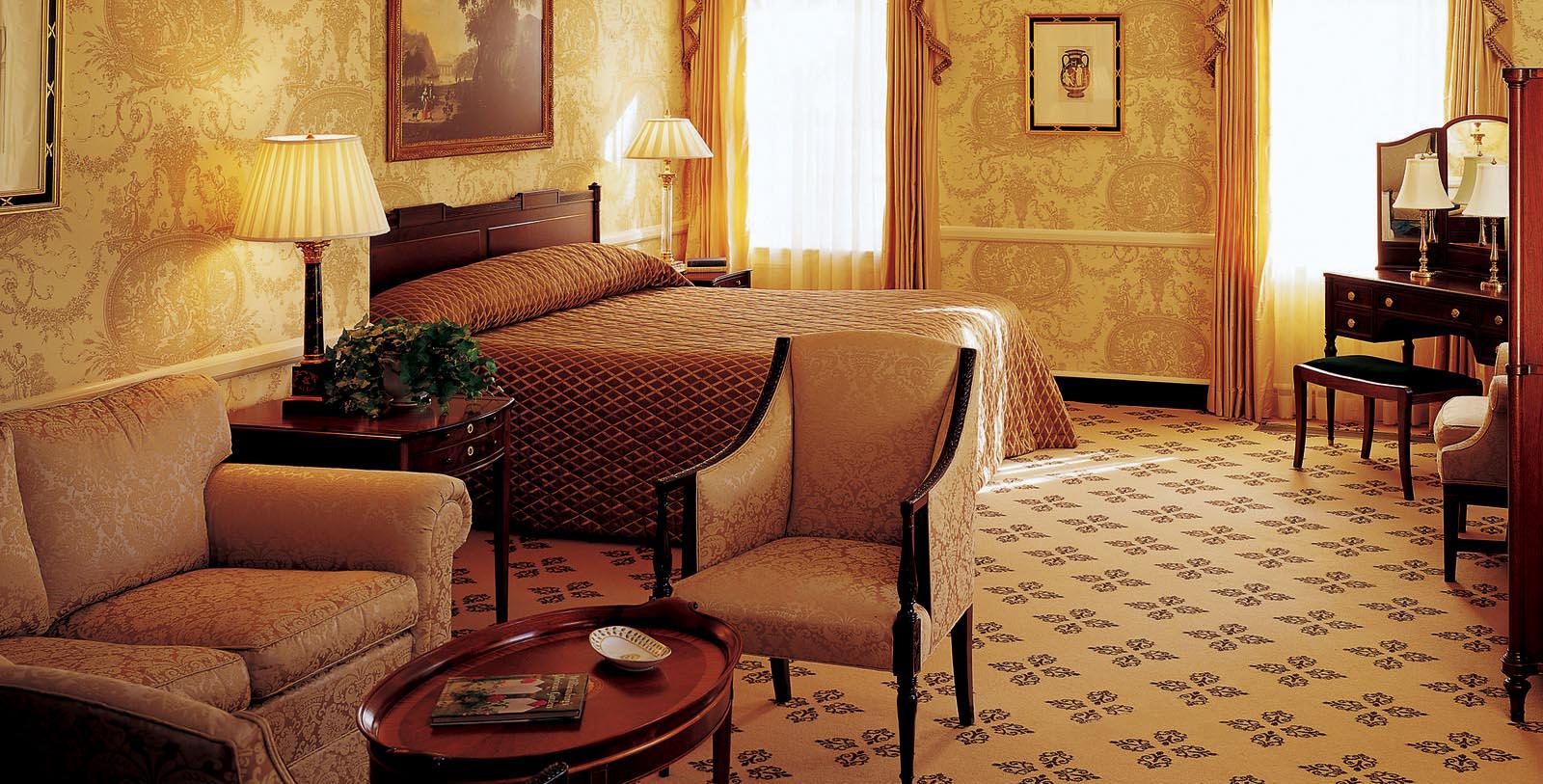 a bedroom with a bed and a chair