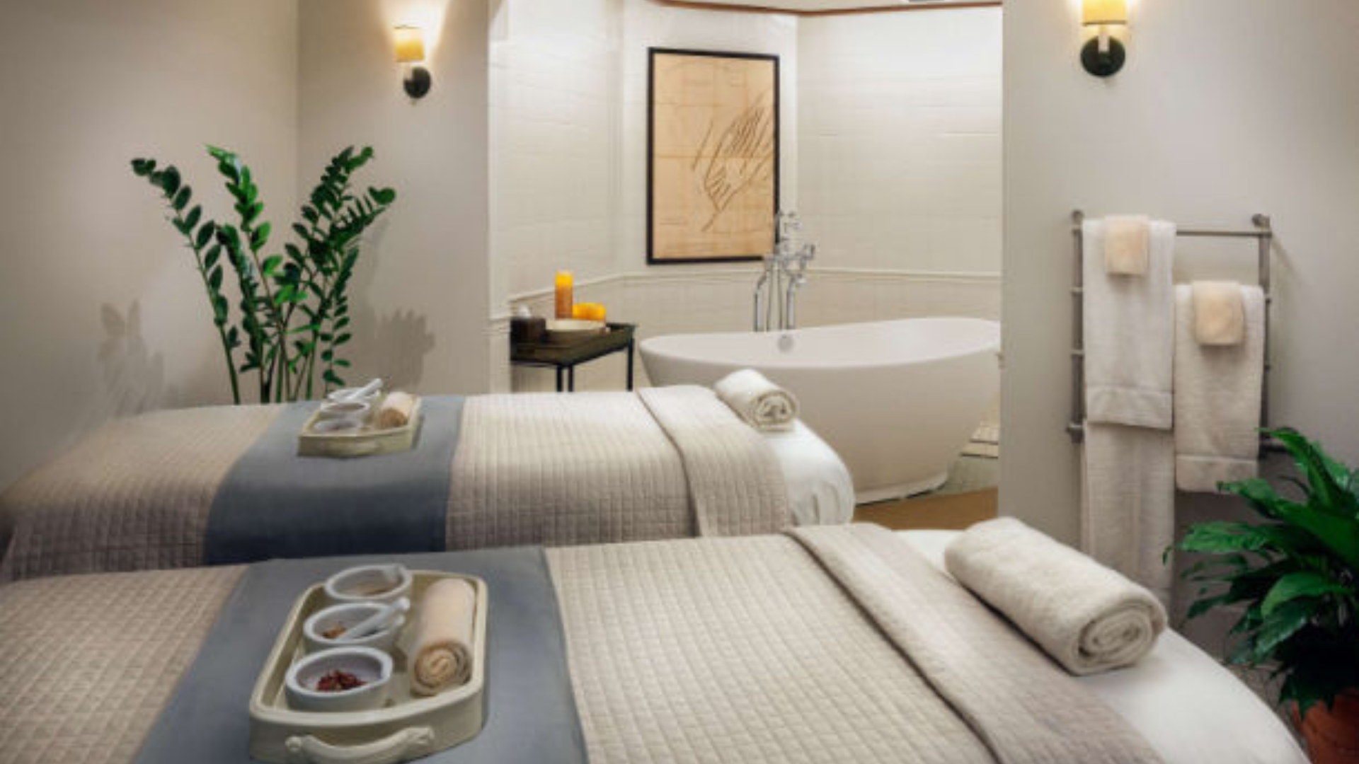 a room with two beds and a bathtub