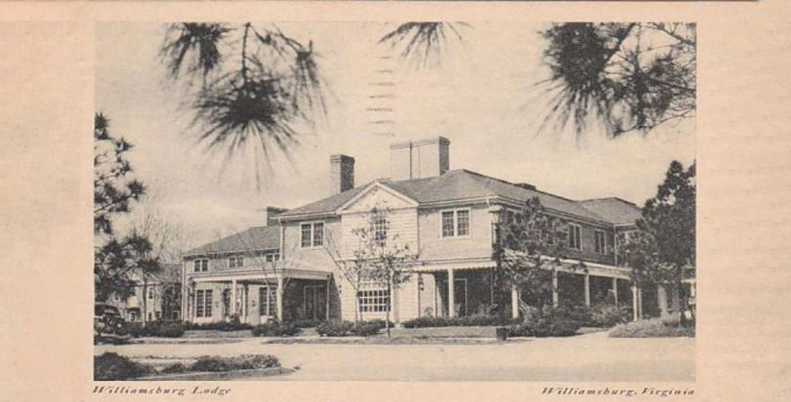 a large house with trees in the background