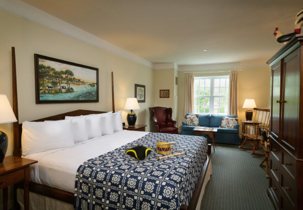 a room with a bed and a chair