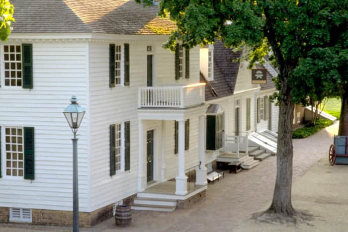 a white house with a tree