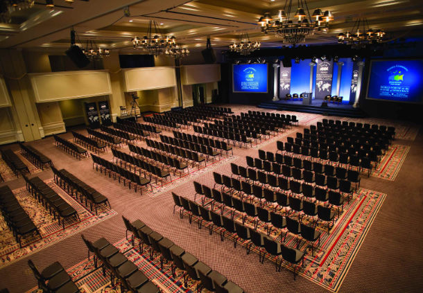 a large auditorium with rows of chairs