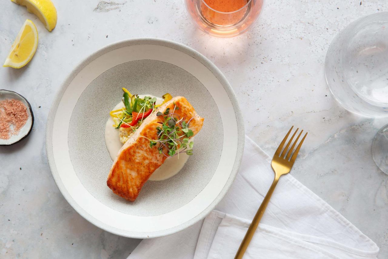 a plate of food with a fork and a glass of liquid