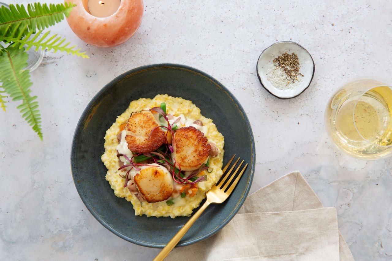 a plate of food with a fork and a candle