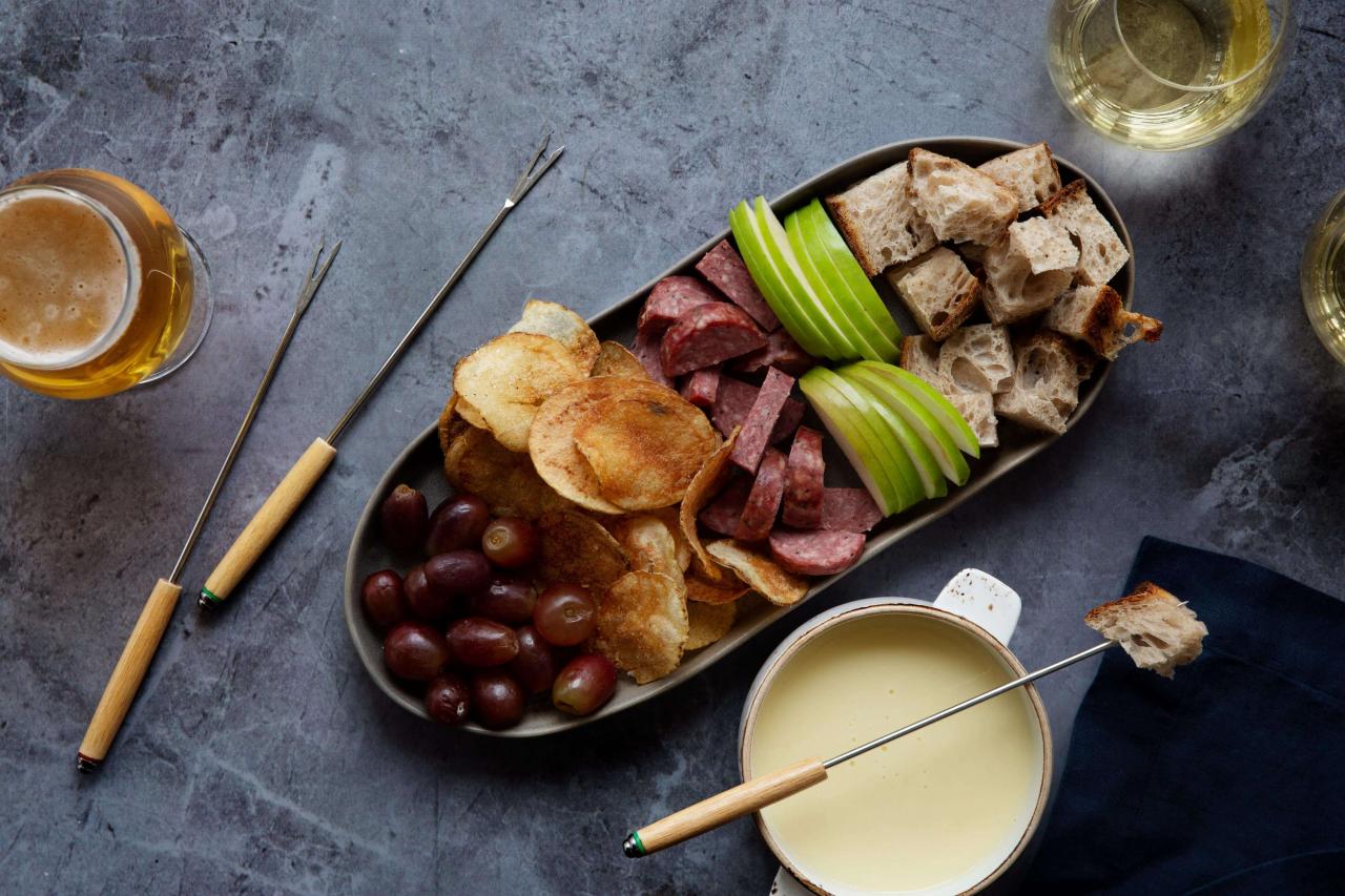a plate of food and a fondue pot