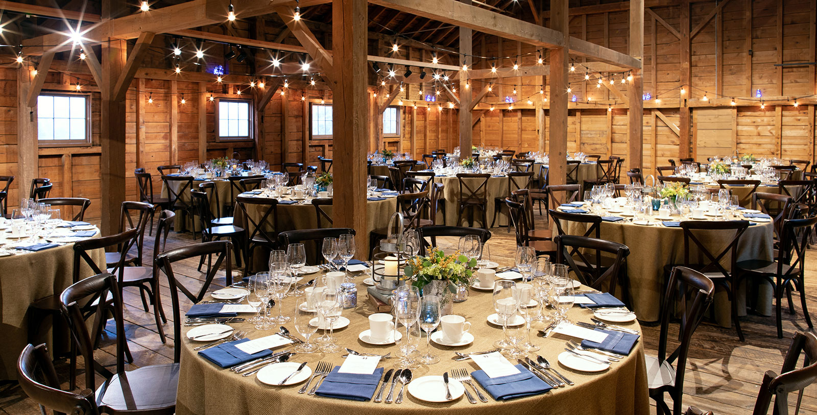 a large round table set for a wedding reception
