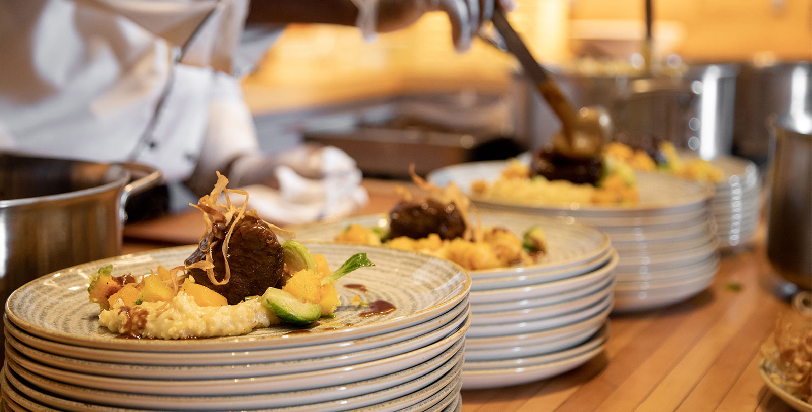 a stack of plates with food on them