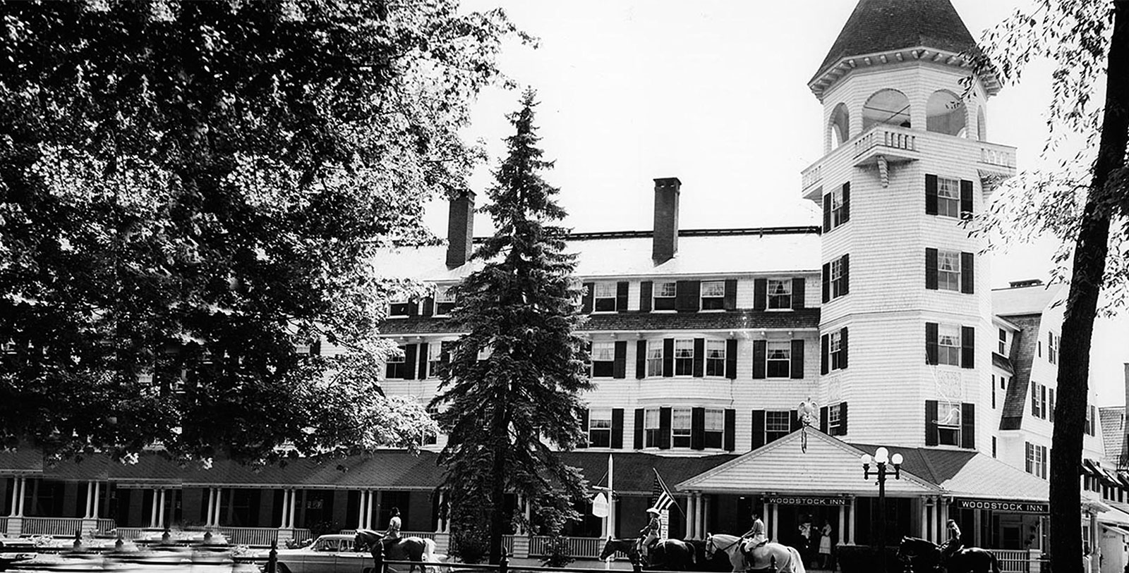 horses in front of a large building