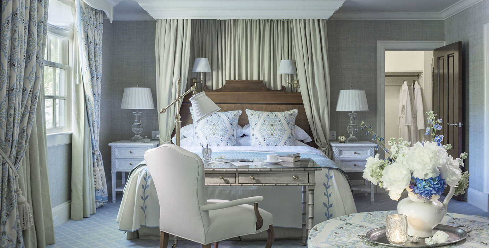a bedroom with a bed and a table