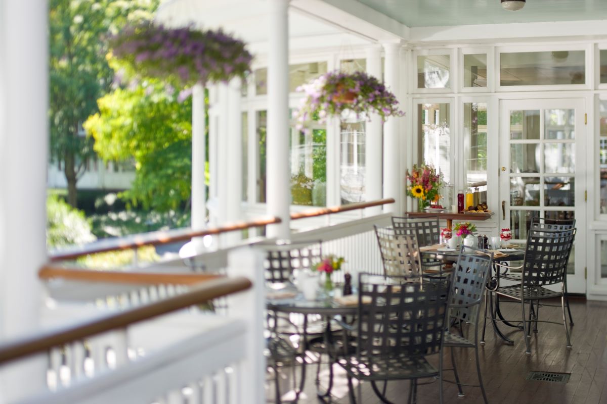 a patio with tables and chairs