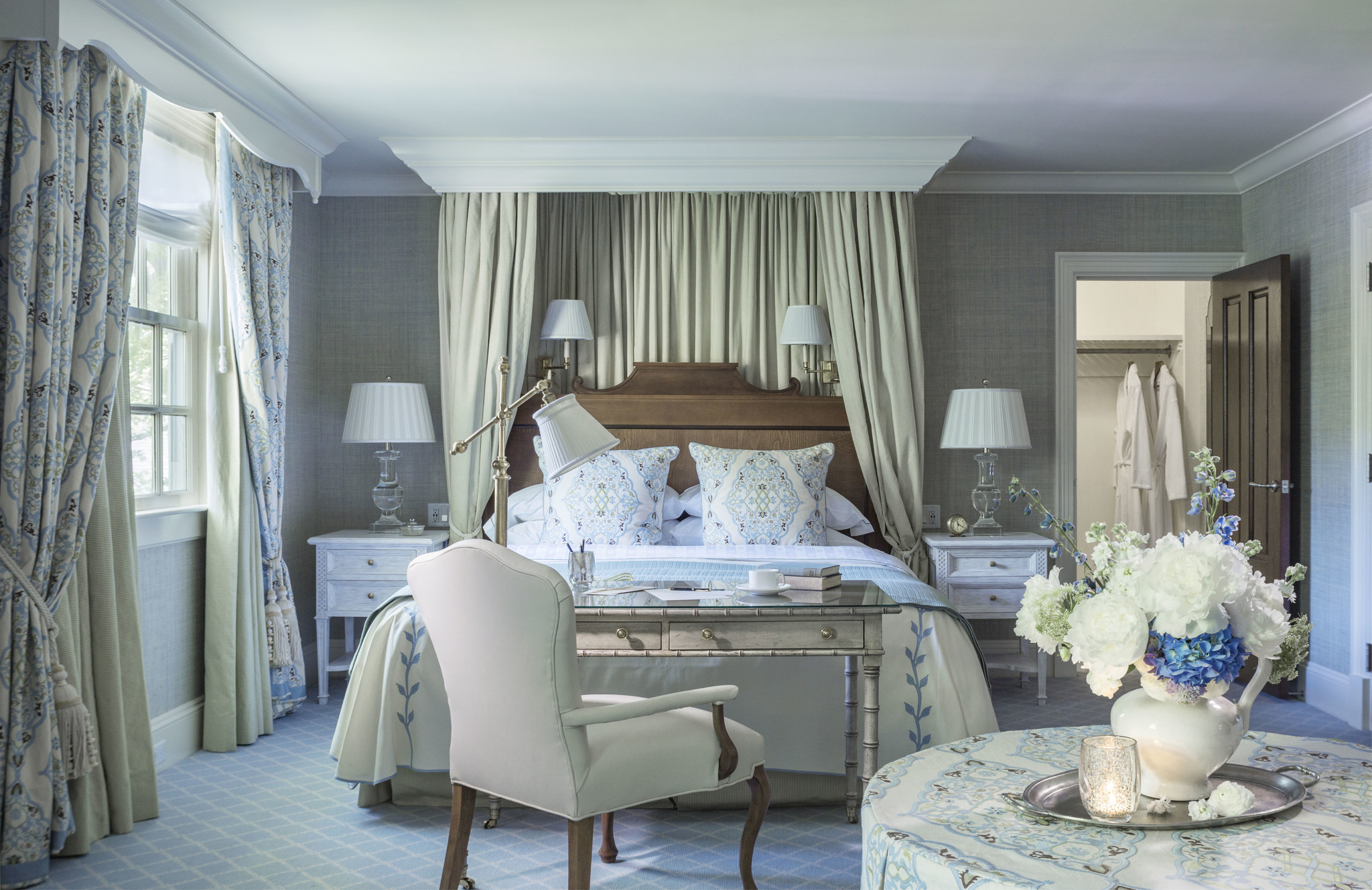 a bedroom with a bed and a table