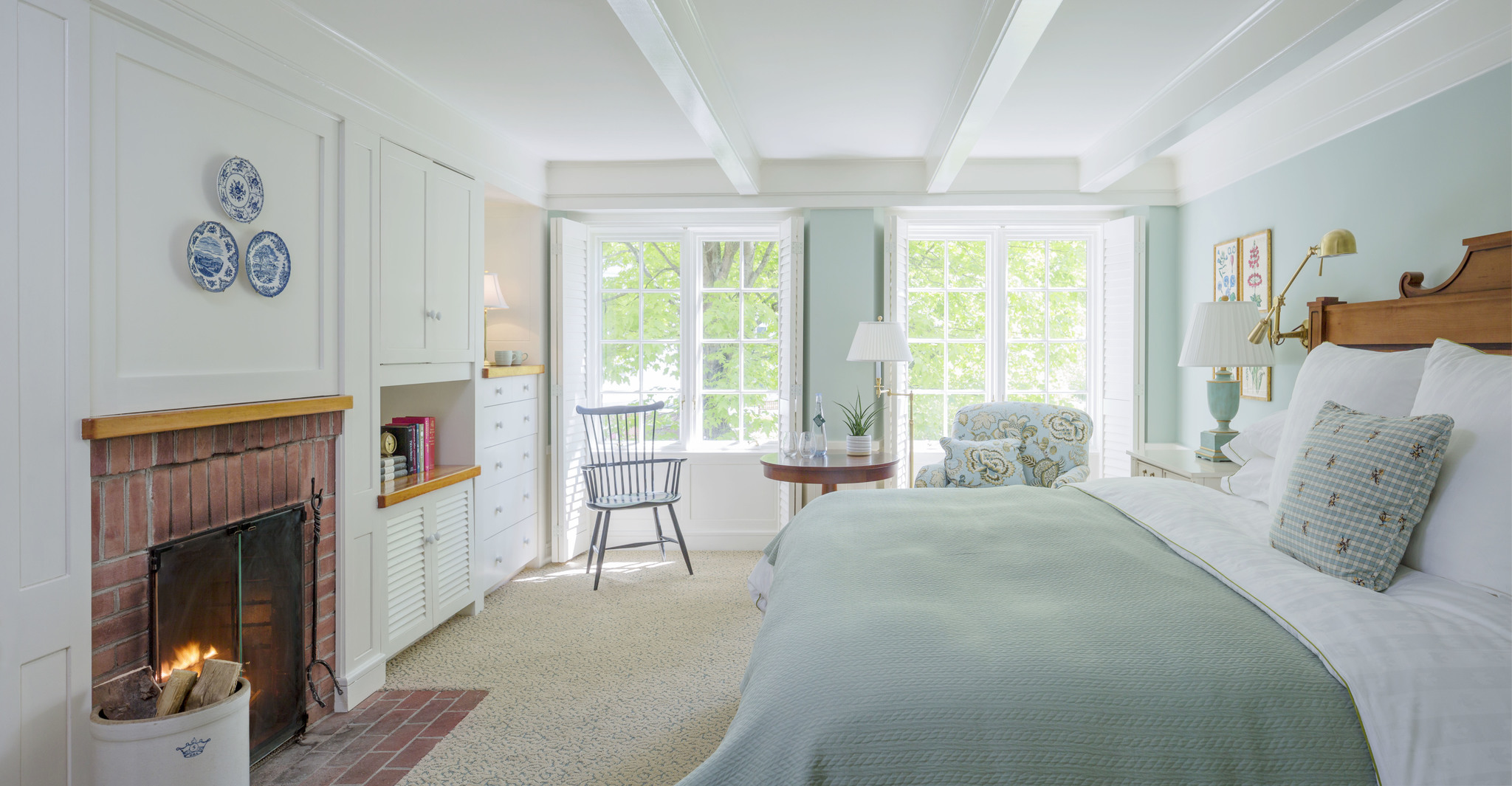 a bedroom with a bed and a chair