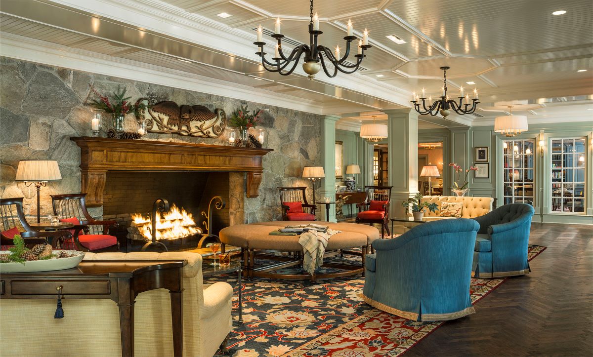 a room with a fireplace and couches