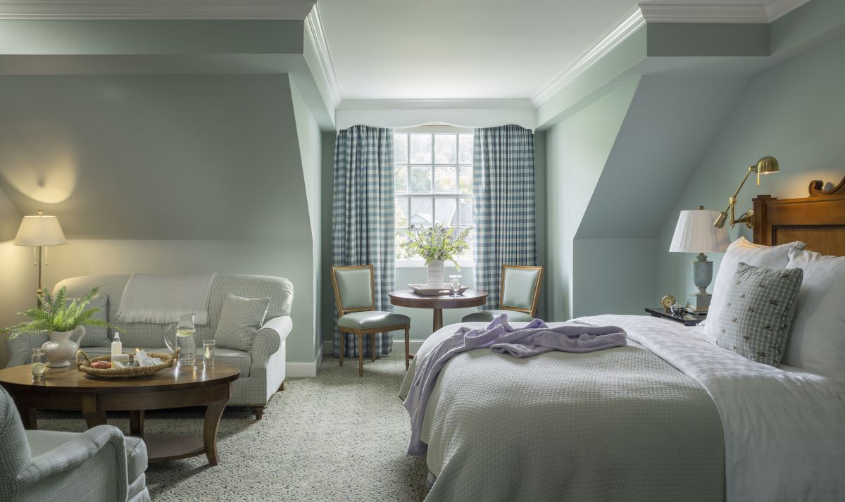 a bedroom with a bed and a table