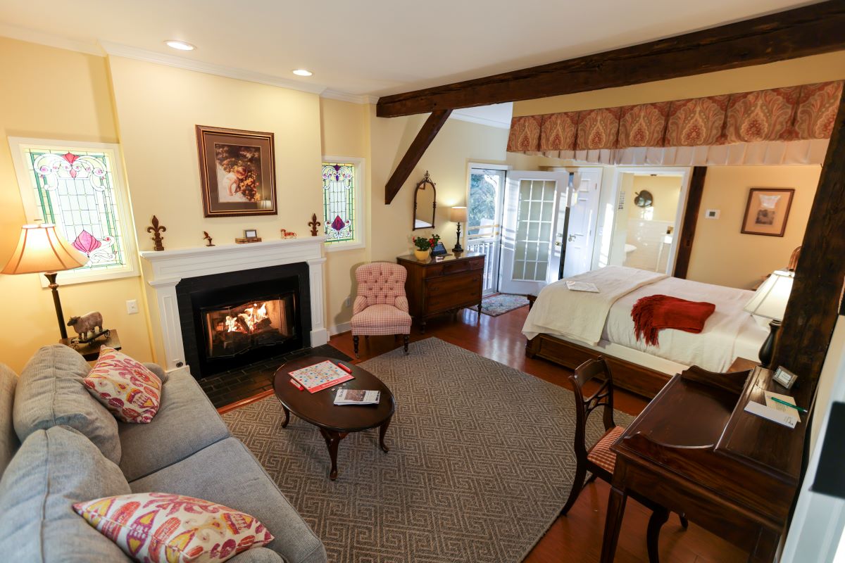 a room with a fireplace and a bed