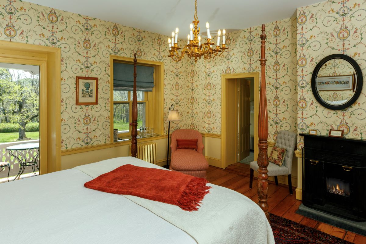 a bedroom with a bed and a chair