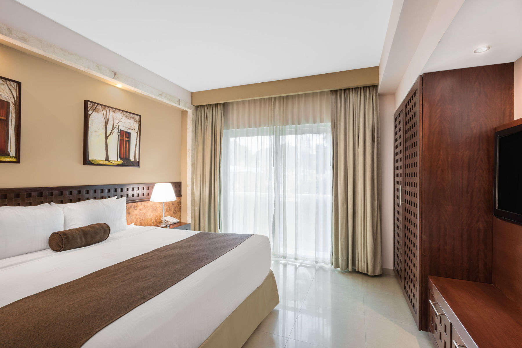 a bedroom with a bed and a cabinet