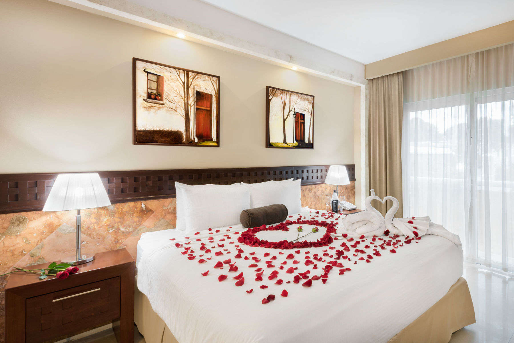a bed with rose petals on it
