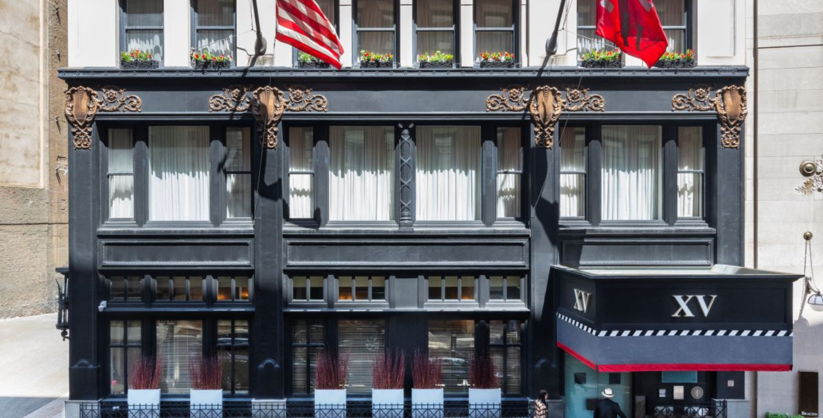 a building with flags on the front