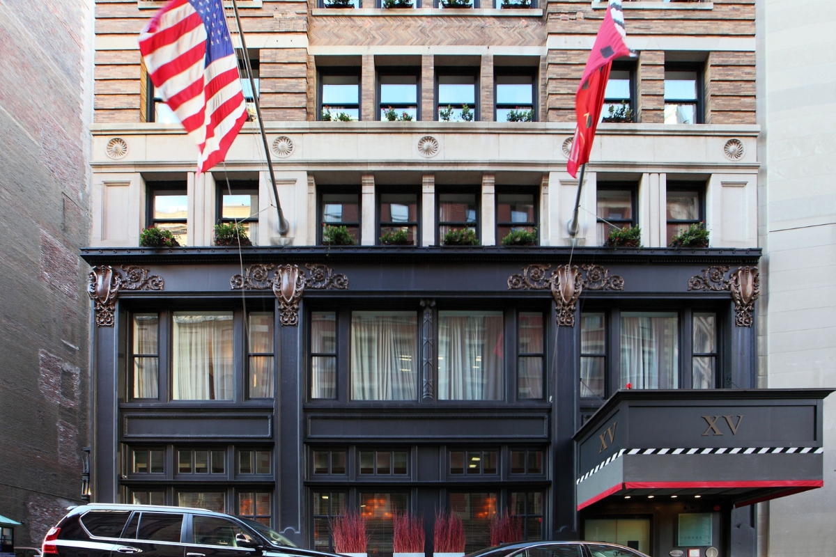 a building with flags on the side