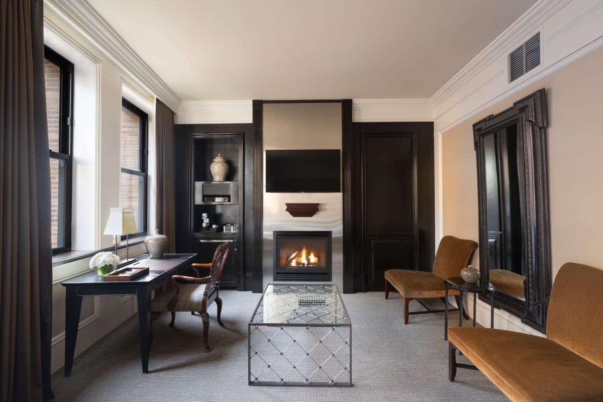a room with a fireplace and a table