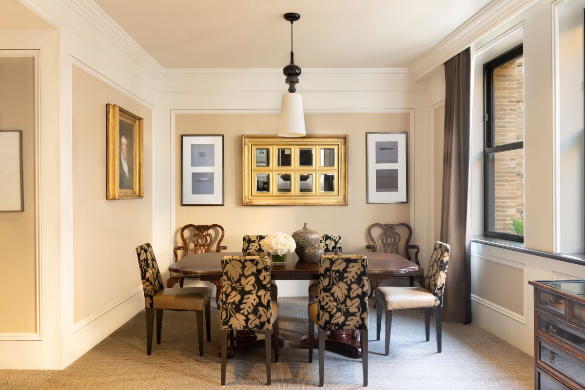 a dining room with a table and chairs