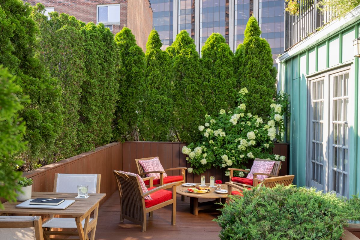 a patio area with chairs and tables
