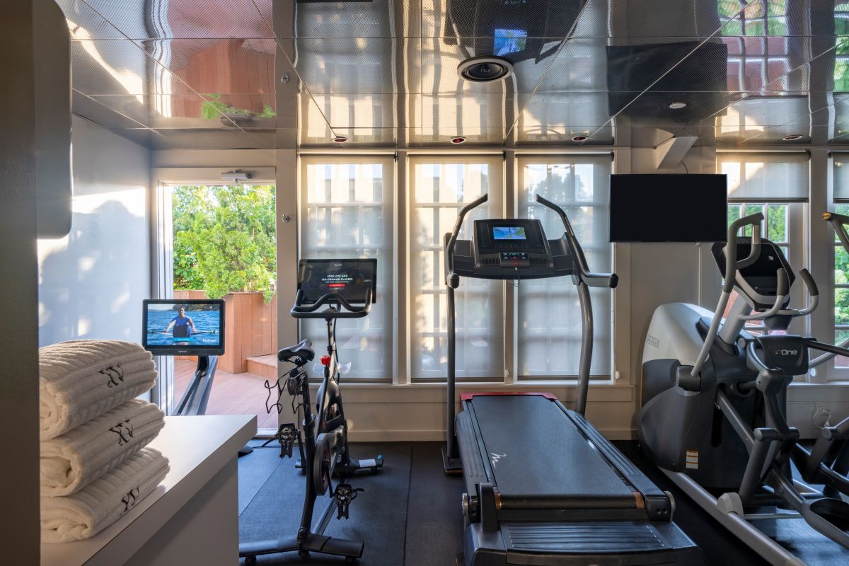 a room with treadmills and a computer